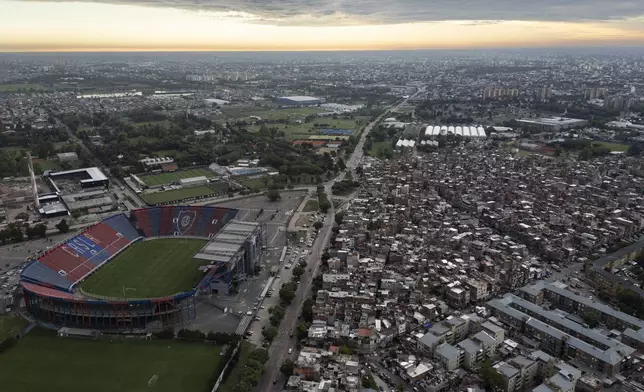 FILE - The sun sets over San Lorenzo's stadium, Pope Francis' soccer team, in the Padre Ricciardelli neighborhood of Buenos Aires, Argentina, Feb. 25, 2025. (AP Photo/Rodrigo Abd, File)