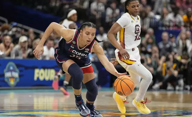 UConn guard Azzi Fudd (35) brings the ball up court during the first half of the national championship game at the Final Four of the women's NCAA college basketball tournament, Sunday, April 6, 2025, in Tampa, Fla. (AP Photo/Chris O'Meara)