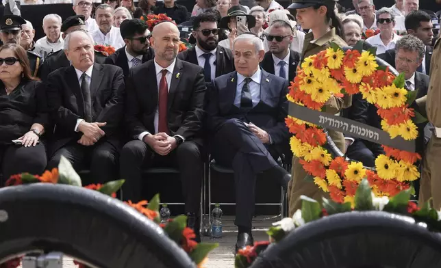 Israeli Prime Minister Benjamin Netanyahu, center right, attends a ceremony marking the annual Holocaust Remembrance Day, at Yad Vashem Holocaust Memorial in Jerusalem, Thursday, April 24, 2025. (AP Photo/Maya Alleruzzo, Pool)