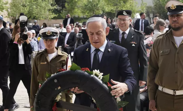 Israeli Prime Minister Benjamin Netanyahu lays a wreath at a ceremony marking the annual Holocaust Remembrance Day, at Yad Vashem Holocaust Memorial in Jerusalem, Thursday, April 24, 2025. (AP Photo/Maya Alleruzzo, Pool)