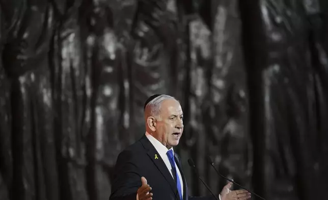 Israeli Prime Minister Benjamin Netanyahu speaks during the opening ceremony of the Holocaust Remembrance Day at the Yad Vashem Holocaust Memorial Museum in Jerusalem on Wednesday, April 23, 2025. (AP Photo/Leo Correa)