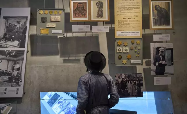 An ultra-Orthodox Jewish man visit the Yad Vashem Holocaust Memorial Museum in Jerusalem, Tuesday, April 22, 2025, ahead of the annual Holocaust remembrance day which begins at sundown Wednesday. (AP Photo/Ohad Zwigenberg)