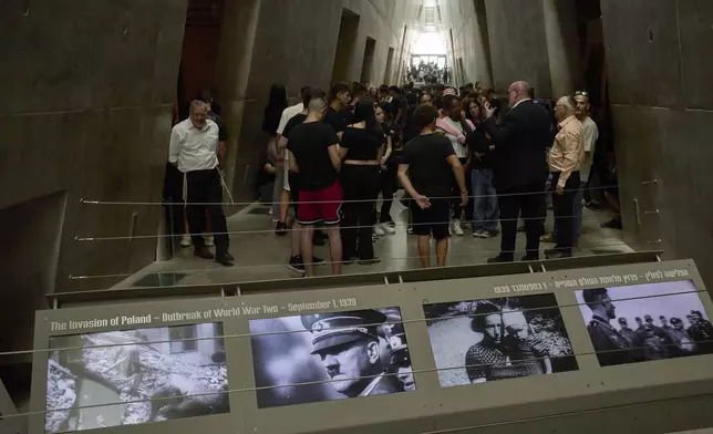 People visit the Yad Vashem Holocaust Memorial Museum in Jerusalem, Tuesday, April 22, 2025, ahead of the annual Holocaust remembrance day which begins at sundown Wednesday. (AP Photo/Ohad Zwigenberg)