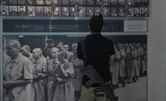 A person visits a the Yad Vashem Holocaust Memorial Museum in Jerusalem, Tuesday, April 22, 2025, ahead of the annual Holocaust remembrance day which begins at sundown Wednesday. (AP Photo/Ohad Zwigenberg)