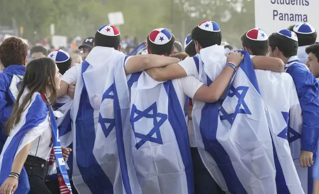Young people from Panama attend the "March of the Living", the annual Holocaust remembrance event in memory of the six million Holocaust victims, at the former Nazi German death camp of Auschwitz-Birkenau in Oswiecim, Poland, Thursday, April 24, 2025. (AP Photo/Czarek Sokolowski)