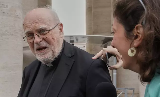 Swedish Cardinal Anders Arborelius is approached by reporters as he arrives for a college of cardinals' meeting, at the Vatican, Monday, April 28, 2025. (AP Photo/Gregorio Borgia)