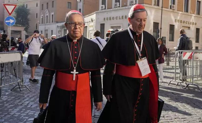 Colombian cardinals Luis José Rueda Aparicio, left, and Rubén Salazar Gómez arrive for a college of cardinals' meeting, at the Vatican, Wednesday, April 30, 2025. (AP Photo/Gregorio Borgia)