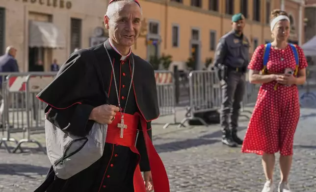 Cardinal Jean-Paul Vesco arrives for a college of cardinals' meeting, at the Vatican, Wednesday, April 30, 2025. (AP Photo/Gregorio Borgia)