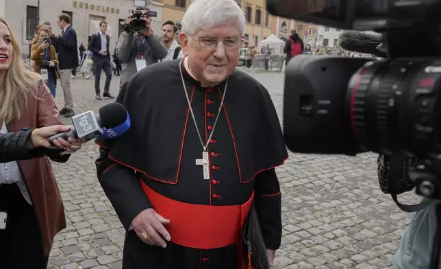 Canadian Cardinal Thomas Christopher Collins is approached by reporters as he arrives for a college of cardinals' meeting, at the Vatican, Monday, April 28, 2025. (AP Photo/Gregorio Borgia)