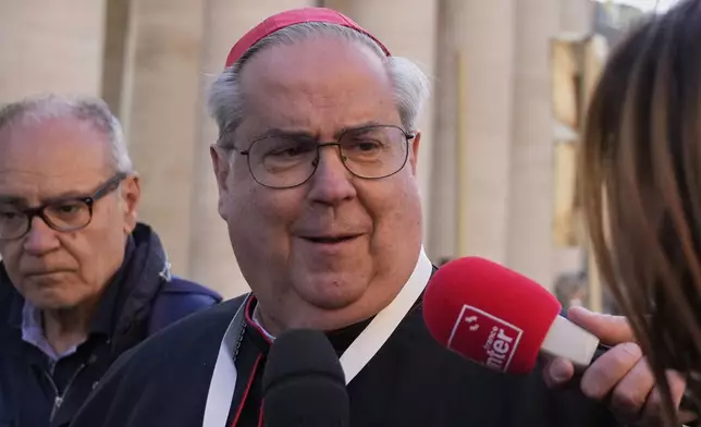 Argentine Cardinal Ángel Sixto Rossi speaks to reporters as he arrives for a college of cardinals' meeting, at the Vatican, Wednesday, April 30, 2025. (AP Photo/Gregorio Borgia)