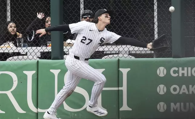Chicago White Sox right fielder Brooks Baldwin can't make the play on a two-run double by Boston Red Sox's Trevor Story during the sixth inning of a baseball game in Chicago, Sunday, April 13, 2025. (AP Photo/Nam Y. Huh)