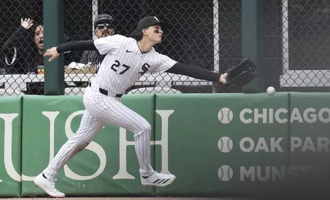 Chicago White Sox right fielder Brooks Baldwin can't make the play on a two-run double by Boston Red Sox's Trevor Story during the sixth inning of a baseball game in Chicago, Sunday, April 13, 2025. (AP Photo/Nam Y. Huh)