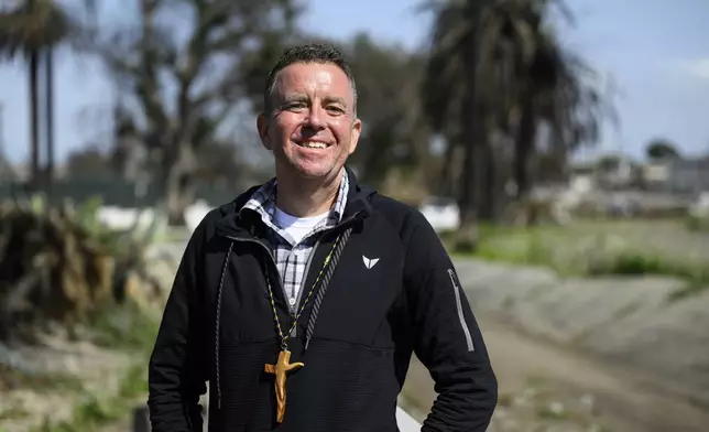 Pastor John Shaver poses for a portrait during a Cross Walk event by the Community United Methodist Church of the Pacific Palisades, Friday, April 18, 2025, in the Pacific Palisades area of Los Angeles. (AP Photo/William Liang)