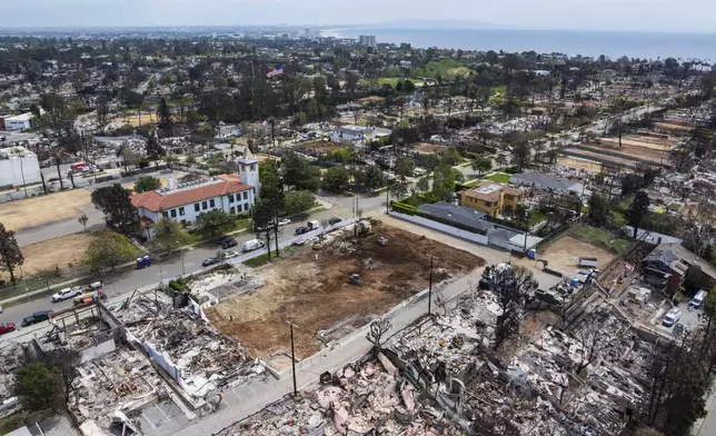 The land, center, where Community United Methodist Church of the Pacific Palisades once stood, Friday, April 18, 2025, in the Pacific Palisades area of Los Angeles. (AP Photo/William Liang)