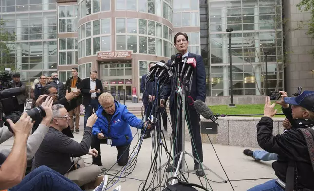 Los Angeles County District Attorney Nathan Hochman speaks outside of court before a hearing in the case of Erik and Lyle Menendez Thursday, April 17, 2025, in Los Angeles. (AP Photo/Damian Dovarganes)