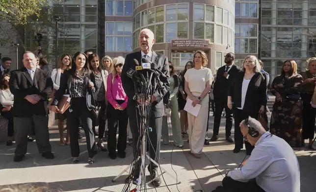 Attorney Mark Geragos speaks after a hearing regarding the case of Erik and Lyle Menendez Friday, April 11, 2025, in Los Angeles. (AP Photo/Damian Dovarganes)