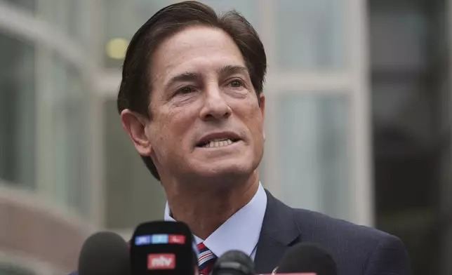 Los Angeles County District Attorney Nathan Hochman speaks outside of the courthouse during a hearing in the case of Erik and Lyle Menendez Thursday, April 17, 2025, in Los Angeles. (AP Photo/Damian Dovarganes)