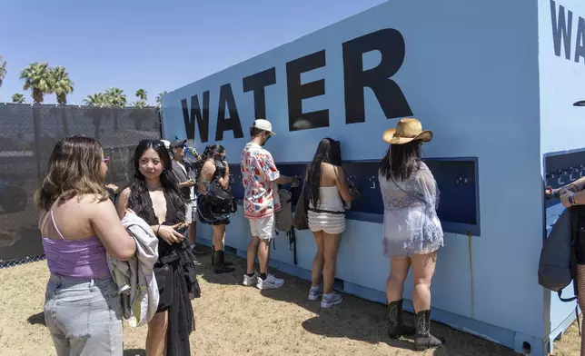 Festivalgoers fill water bottles during the first weekend of the Coachella Valley Music and Arts Festival at the Empire Polo Club on Friday, April 11, 2025, in Indio, Calif. (Photo by Amy Harris/Invision/AP)