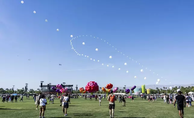Festivalgoers are seen during the first weekend of the Coachella Valley Music and Arts Festival at the Empire Polo Club on Friday, April 11, 2025, in Indio, Calif. (Photo by Amy Harris/Invision/AP)