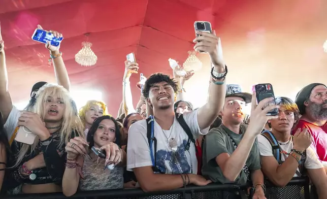 Festivalgoers are seen during the first weekend of the Coachella Valley Music and Arts Festival at the Empire Polo Club on Saturday, April 12, 2025, in Indio, Calif. (Photo by Amy Harris/Invision/AP)