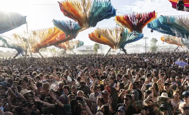 Festivalgoers are seen during the first weekend of the Coachella Valley Music and Arts Festival at the Empire Polo Club on Saturday, April 12, 2025, in Indio, Calif. (Photo by Amy Harris/Invision/AP)
