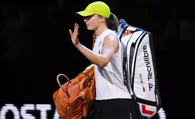 Poland's Iga Swiatek after losing against Lithuania's Jelena Ostapenko during their women's singles quarterfinal tennis match at the WTA tour in Stuttgart, Germany, Saturday, April 19, 2025. (Marijan Murat/dpa via AP)
