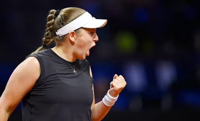 Lithuania's Jelena Ostapenko in action against Poland's Iga Swiatek during their women's singles quarterfinal tennis match at the WTA tour in Stuttgart, Germany, Saturday, April 19, 2025. (Marijan Murat/dpa via AP)