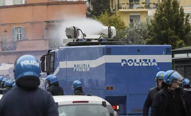 Lazio fans riot with police ahead of the Italian Serie A soccer match between Lazio and Roma at Rome's Olympic stadium, Sunday, April 13, 2025. (AP Photo/Gregorio Borgia)