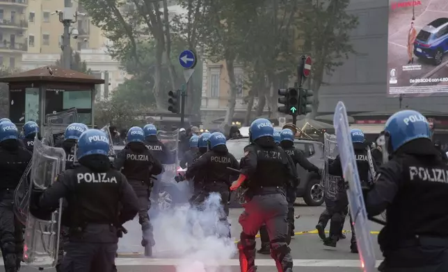 Lazio fans riot with police ahead of the Italian Serie A soccer match between Lazio and Roma at Rome's Olympic stadium, Sunday, April 13, 2025. (AP Photo/Gregorio Borgia)