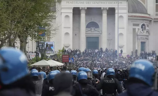 Lazio fans riot with police ahead of the Italian Serie A soccer match between Lazio and Roma at Rome's Olympic stadium, Sunday, April 13, 2025. (AP Photo/Gregorio Borgia)