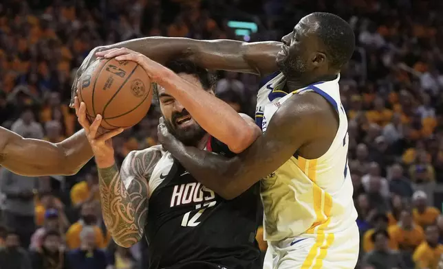 Houston Rockets center Steven Adams, left, is fouled by Golden State Warriors forward Draymond Green during the second half of Game 3 of an NBA basketball first-round playoff series in San Francisco, Saturday, April 26, 2025. (AP Photo/Jeff Chiu)