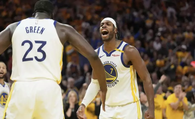 Golden State Warriors forward Draymond Green (23) celebrates with guard Buddy Hield (7) during the second half of Game 3 of an NBA basketball first-round playoff series against the Houston Rockets in San Francisco, Saturday, April 26, 2025. (AP Photo/Jeff Chiu)