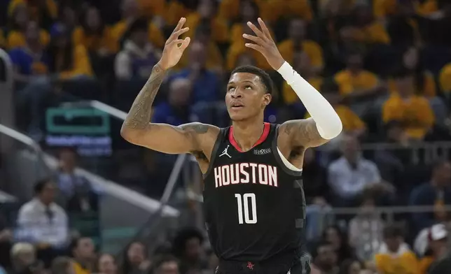 Houston Rockets forward Jabari Smith Jr. (10) celebrates after scoring against the Golden State Warriors during the first half of Game 3 of an NBA basketball first-round playoff series in San Francisco, Saturday, April 26, 2025. (AP Photo/Jeff Chiu)