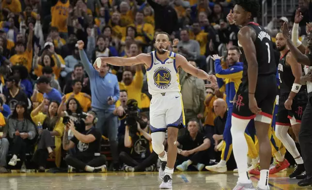 Golden State Warriors guard Stephen Curry (30) celebrates after making a 3-point basket during the second half of Game 3 of an NBA basketball first-round playoff series against the Houston Rockets in San Francisco, Saturday, April 26, 2025. (AP Photo/Jeff Chiu)