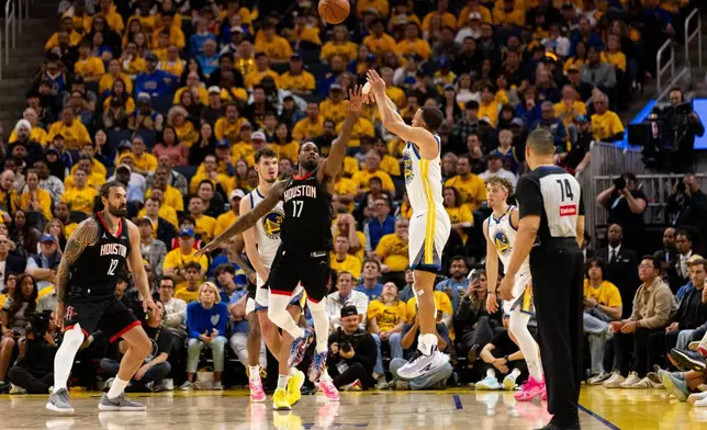 Golden State Warriors guard Stephen Curry (30) shoots a three-point shotduring the second quarter in game 3 of the NBA Western Conference First Round against the Houston Rockets in San Francisco, Saturday, April 26, 2025. (Stephen Lam/San Francisco Chronicle via AP)