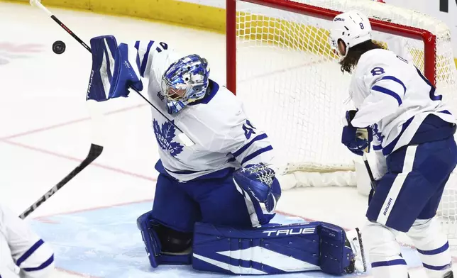 Toronto Maple Leafs goaltender Anthony Stolarz (41) makes a blocker save during the third period of an NHL hockey game against the Buffalo Sabres, Tuesday, April 15, 2025, in Buffalo, N.Y. (AP Photo/Jeffrey T. Barnes)