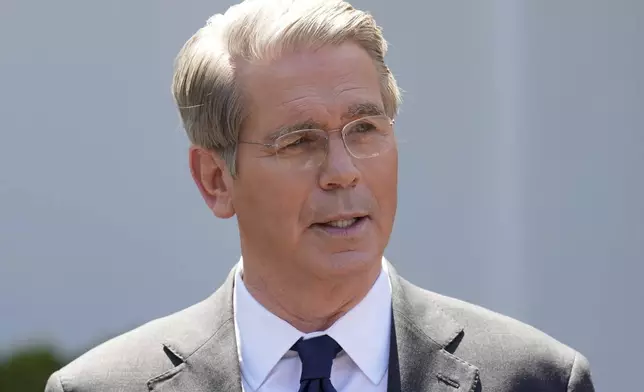 Treasury Secretary Scott Bessent speaks to reporters outside the West Wing of the White House, Wednesday, April 9, 2025, in Washington. (AP Photo/Jacquelyn Martin)