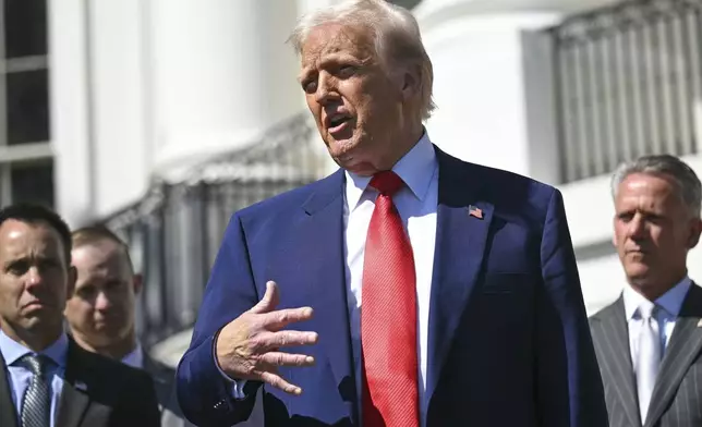 President Donald Trump speaks during an event with auto racing champions at the South Portico of the White House Wednesday, April 9, 2025, in Washington, (Pool via AP)