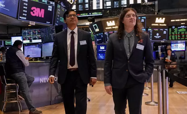 XPRIZE Carbon Removal winners from Mati Carbon, Founder &amp; CEO Shantanu Agarwal, left, and Chief Science Officer Jake Jordan, visit the trading floor of the New York Stock Exchange, Tuesday, April 22, 2025. (AP Photo/Richard Drew)