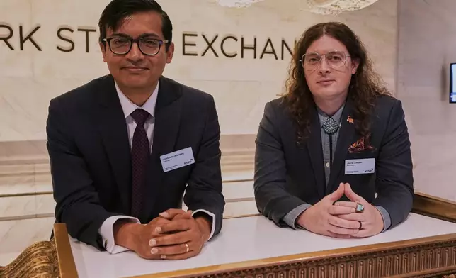 XPRIZE Carbon Removal winners from Mati Carbon, Founder &amp; CEO Shantanu Agarwal, left, and Chief Science Officer Jake Jordan, visit the trading floor of the New York Stock Exchange, Tuesday, April 22, 2025. (AP Photo/Richard Drew)