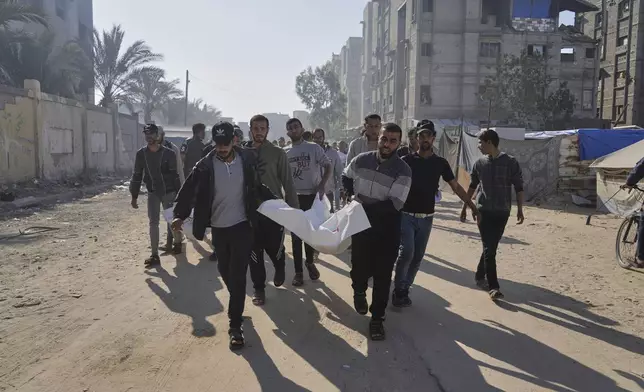 Palestinians carry the bodies of their relatives killed in an Israeli army airstrike, during their funeral in Khan Younis, southern Gaza Strip, Saturday, April 19, 2025. (AP Photo/Abdel Kareem Hana)