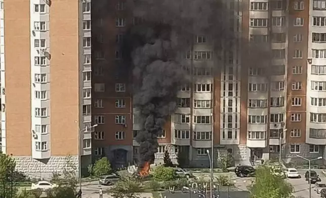 In this handout photo released by OSTOROZHNO NOVOSTI, flames and smoke rise from the scene where Lt. Gen. Yaroslav Moskalik, a deputy head of the main operational department in the Ge eral Staff of the Russian armed forces, was killed by an explosive device placed in a car in Balashikha, just outside Moscow, Russia, on Friday, April 25, 2025. (OSTOROZHNO NOVOSTI via AP)