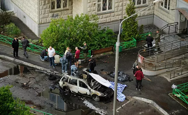 Investigators work the scene where Lt. Gen. Yaroslav Moskalik, a deputy head of the main operational department in the General Staff of the Russian armed forces, was killed by an explosive device placed in his car in Balashikha, just outside Moscow, Russia, on Friday, April 25, 2025. (AP Photo)