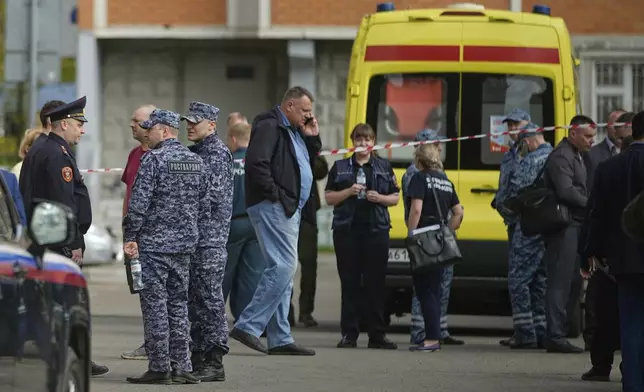 Police and investigators work at the scene where Lt. Gen. Yaroslav Moskalik, a deputy head of the main operational department in the General Staff of the Russian armed forces, was killed by an explosive device placed in his car in Balashikha, just outside Moscow, Russia, on Friday, April 25, 2025. (AP Photo)