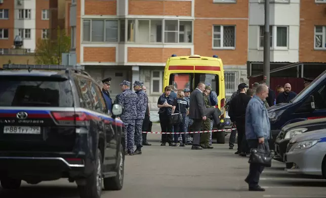 Police and investigators work at the scene where Lt. Gen. Yaroslav Moskalik, a deputy head of the main operational department in the General Staff of the Russian armed forces, was killed by an explosive device placed in his car in Balashikha, just outside Moscow, Russia, on Friday, April 25, 2025. (AP Photo)