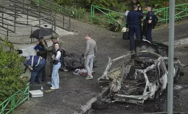 Investigators work at the scene where Lt. Gen. Yaroslav Moskalik, a deputy head of the main operational department in the General Staff of the Russian armed forces, was killed by an explosive device placed in his car in Balashikha, just outside Moscow, Russia, on Friday, April 25, 2025. (AP Photo)