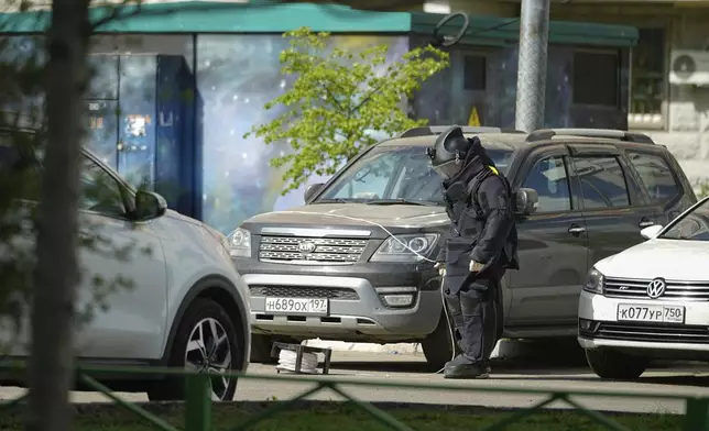 A sapper works at the scene where Lt. Gen. Yaroslav Moskalik, a deputy head of the main operational department in the General Staff of the Russian armed forces, was killed by an explosive device placed in a car in Balashikha, just outside Moscow, Russia, on Friday, April 25, 2025. (AP Photo)