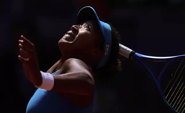 Naomi Osaka, of Japan, serves against Lucia Bronzetti, of Italy, at the Madrid Open tennis tournament in Madrid, Spain, Tuesday, April 22, 2025. (AP Photo/Manu Fernandez)