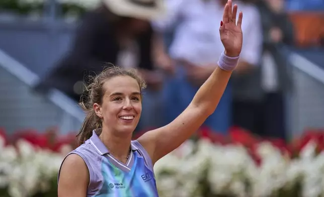 Lucia Bronzetti, of Italy, celebrates after winning against Naomi Osaka, of Japan, during the Madrid Open tennis tournament in Madrid, Spain, Tuesday, April 22, 2025. (AP Photo/Manu Fernandez)