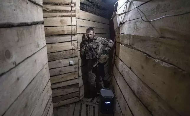 In this photo provided by Ukraine's 93rd Kholodnyi Yar Separate Mechanized Brigade press service, a soldier talks on the phone in a shelter in Kostyantynivka, the site of the heavy battles with the Russian troops in the Donetsk region, Ukraine, Thursday, April 24, 2025. (Iryna Rybakova/Ukraine's 93rd Mechanized Brigade via AP).